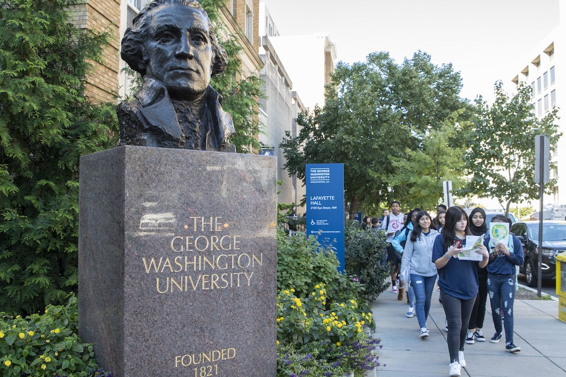 GW Bust with students walking by on sidewalk